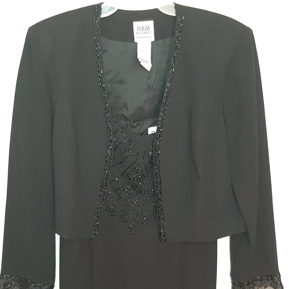 Sleeveless black dress with jacket